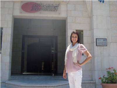 Student standing in front of Jordan Institute of Diplomacy