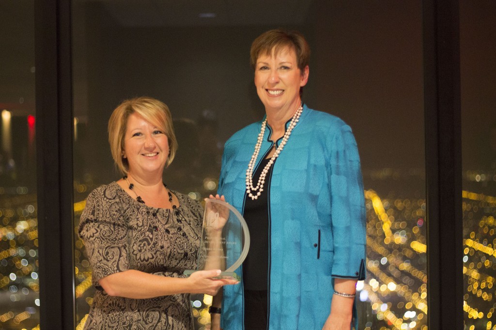 CMC Director of Off-Campus Studies Kristen Mallory (left) receives the Professional Development Award from Dr. Mary Dwyer, President and CEO of IES Abroad.