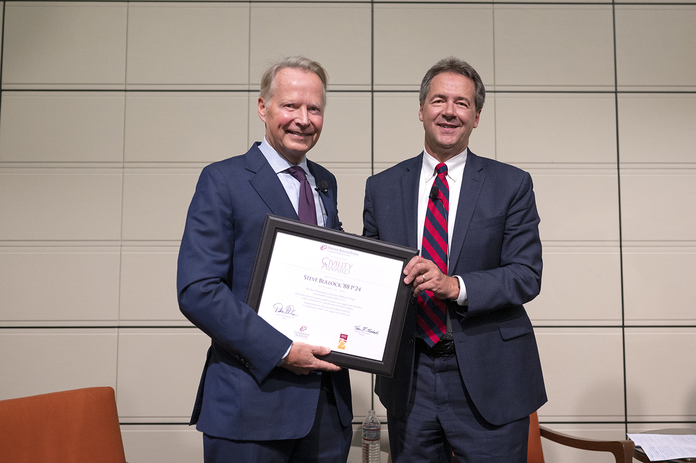Steve Bullock '88 P'24 (left) is presented the inaugural Civility Award by David Dreier '75 (right) on the Athenaeum stage