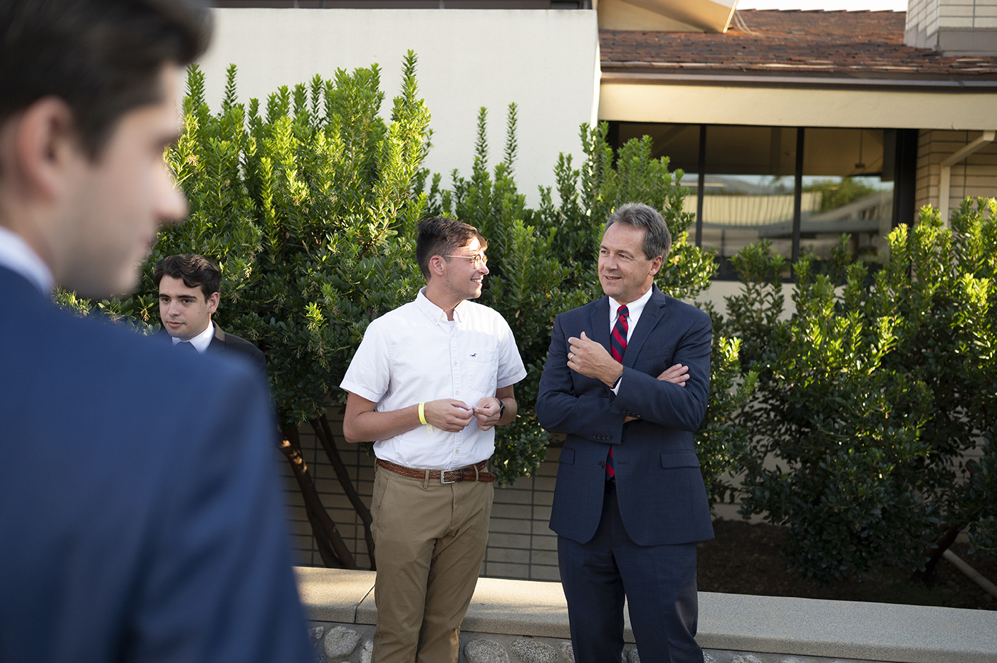 Steve Bullock '88 P'24 has a one-on-one with a student outside of the Ath building