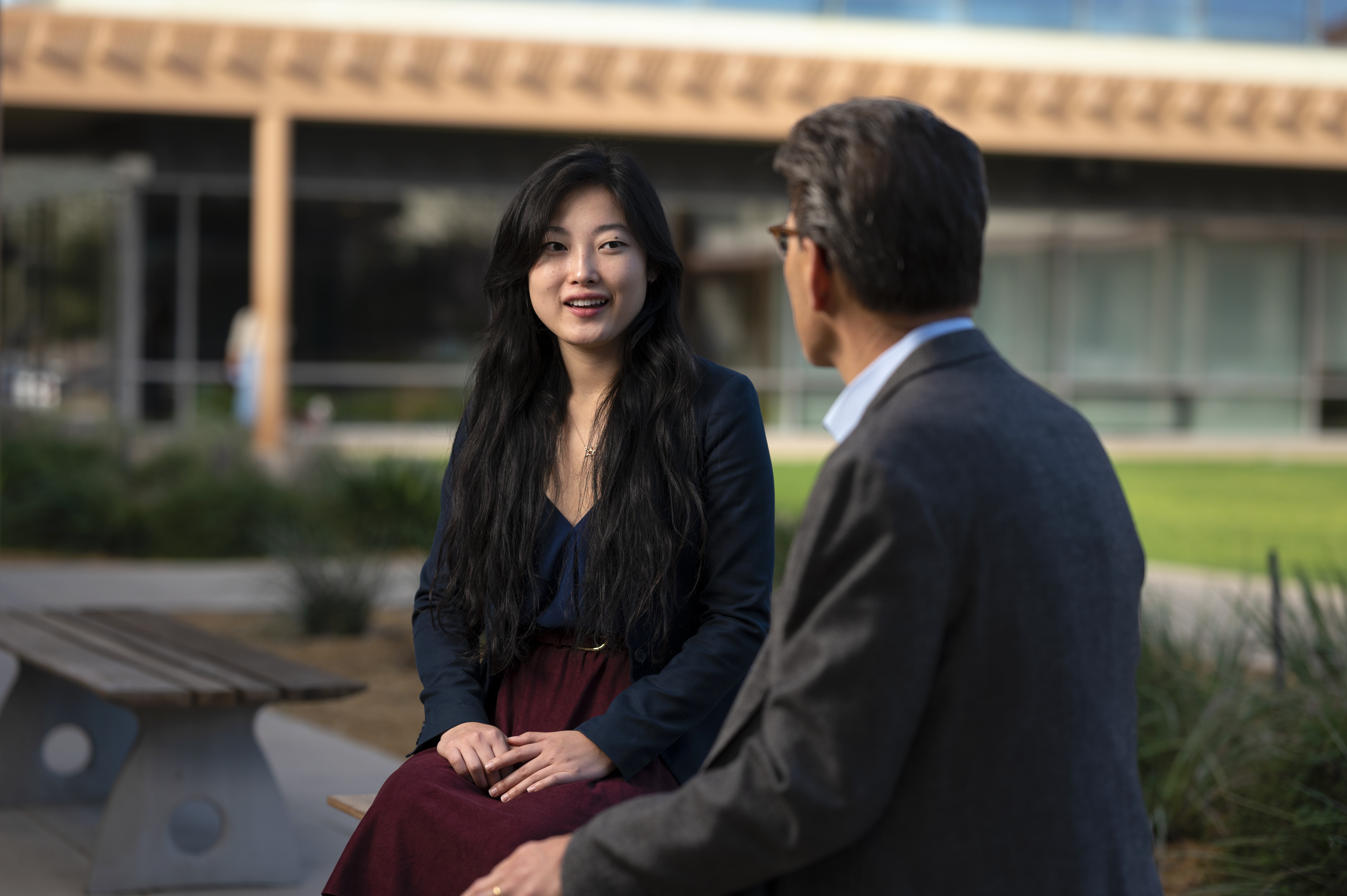 Sarah Chen '22 sits with President Chodosh in front of the Kravis Center.