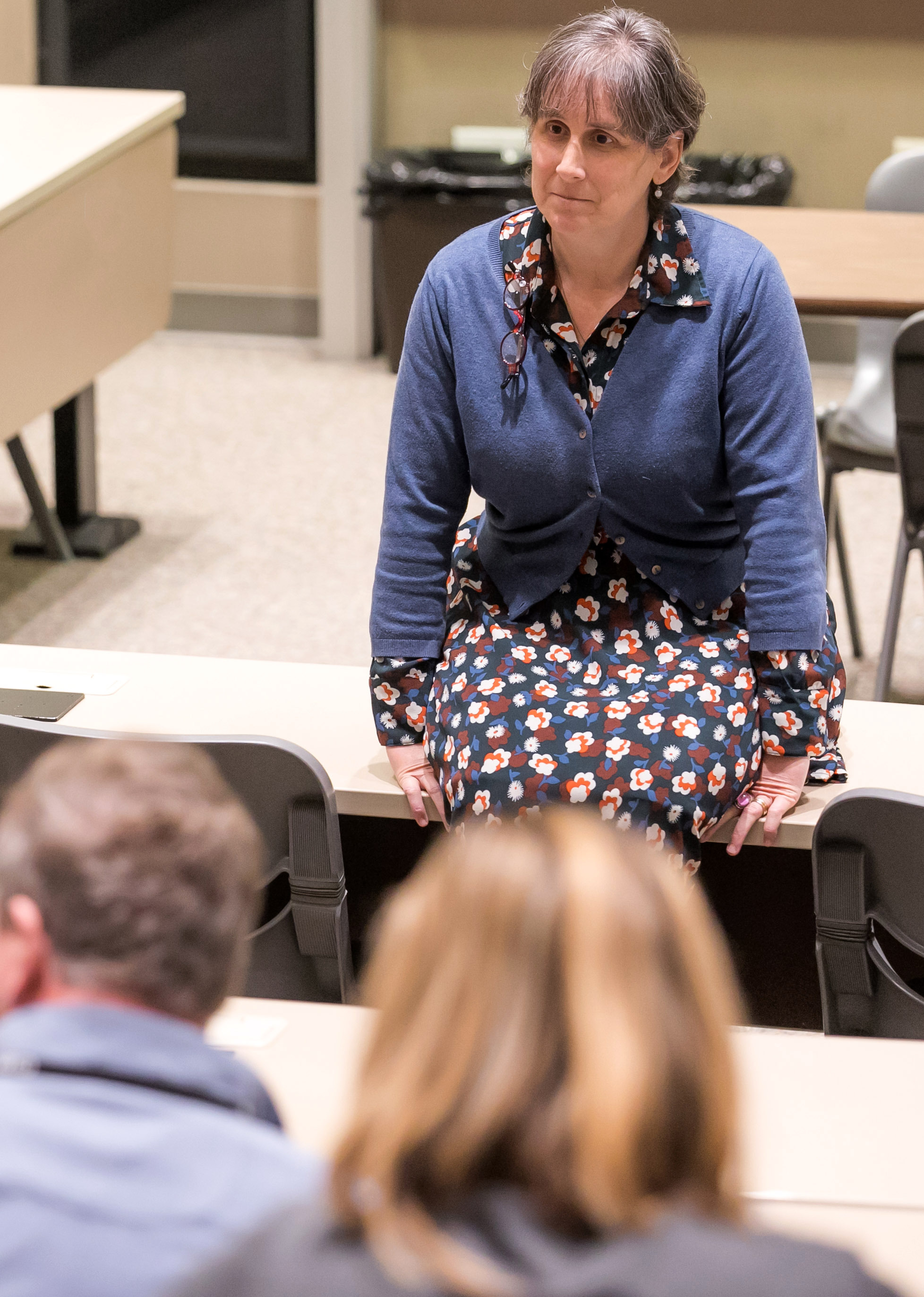Associate Professor Jennifer Taw sits in a lecture hall during Family Weekend 2020.