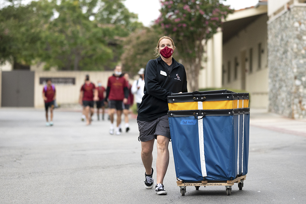 'DT' Graves pictured rolling a large blue bin on freshman move-in and family orientation at Claremont McKenna College on Sunday, August 22, 2021.