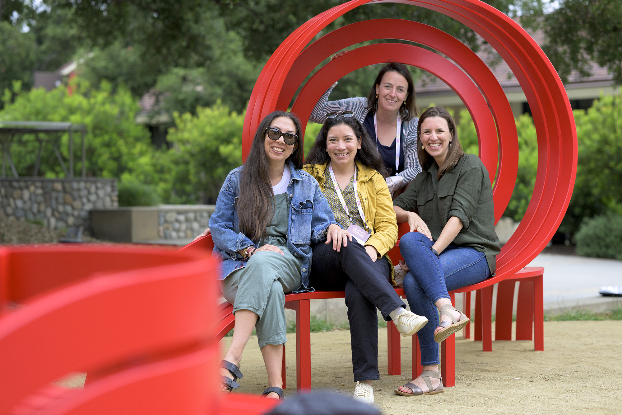 CMC alumnae take a photo opp on the new Jeppe Hein benches during 2022 Alumni Weekend.