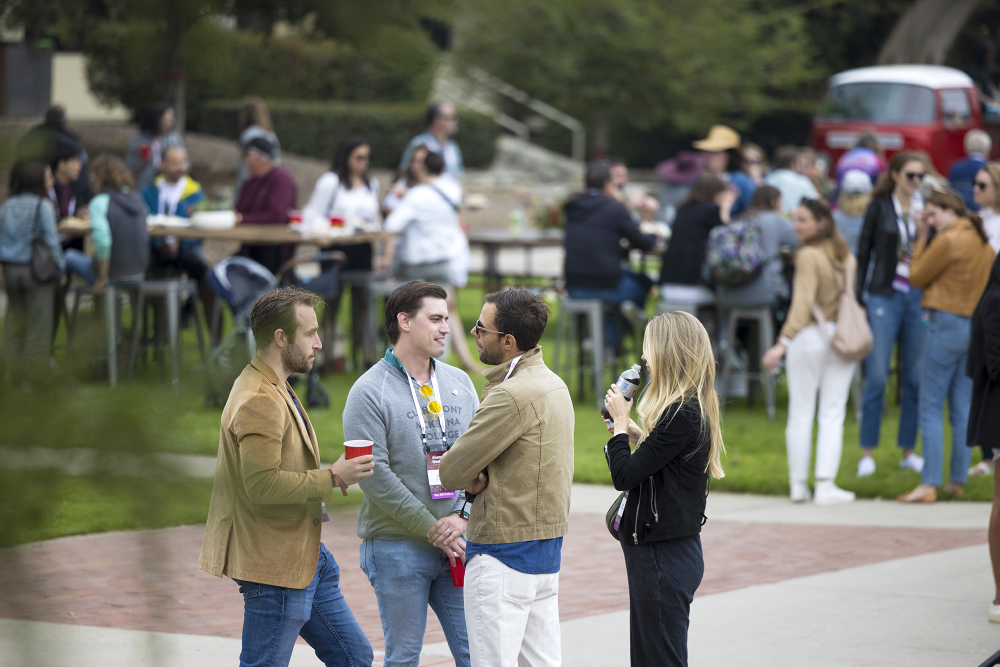 A group of alumni catch up together in North Quad during the second day of 2022 Alumni Weekend