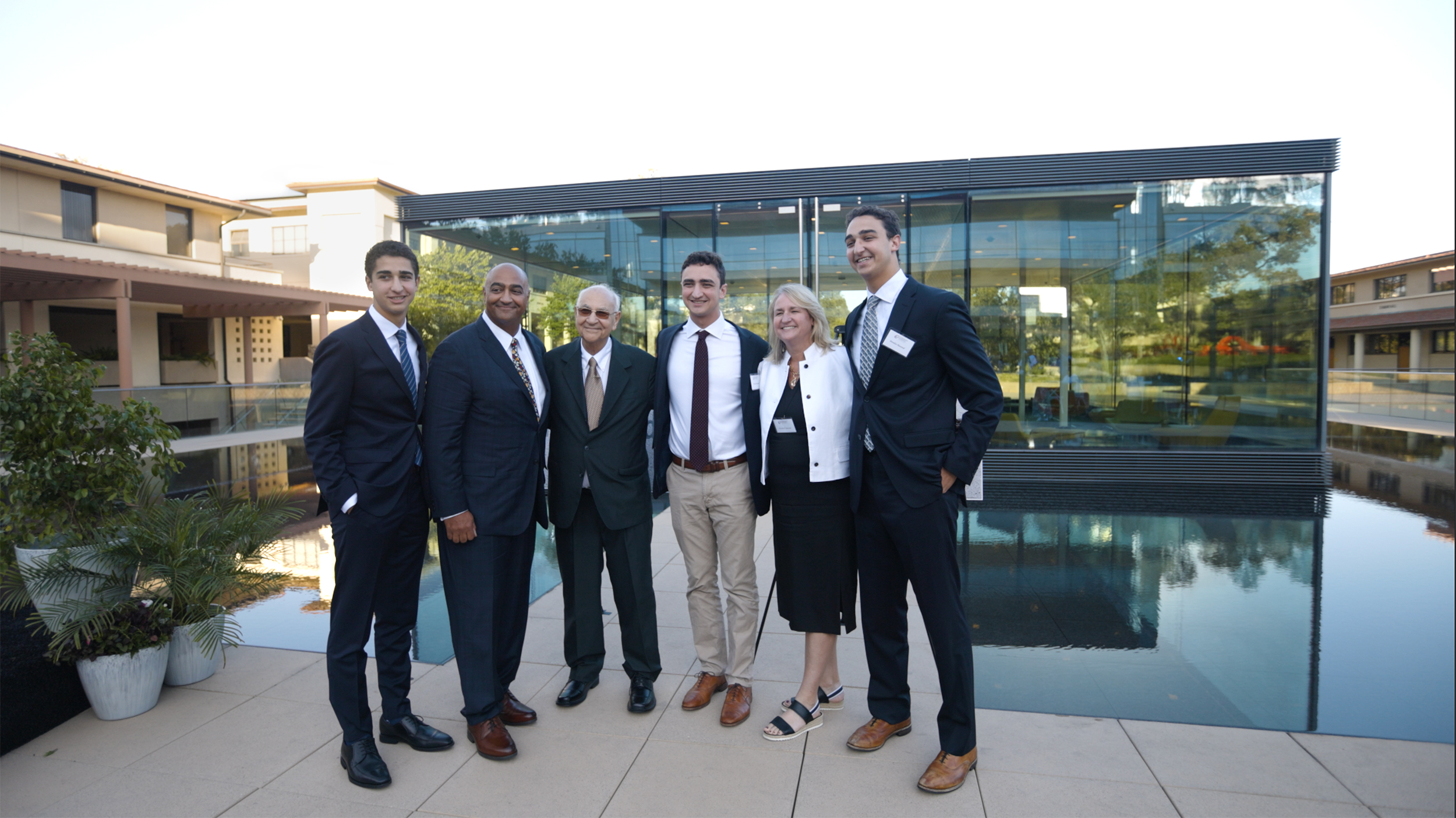 Prof. Massoud’s family stand arm in arm in front of his namesake building.