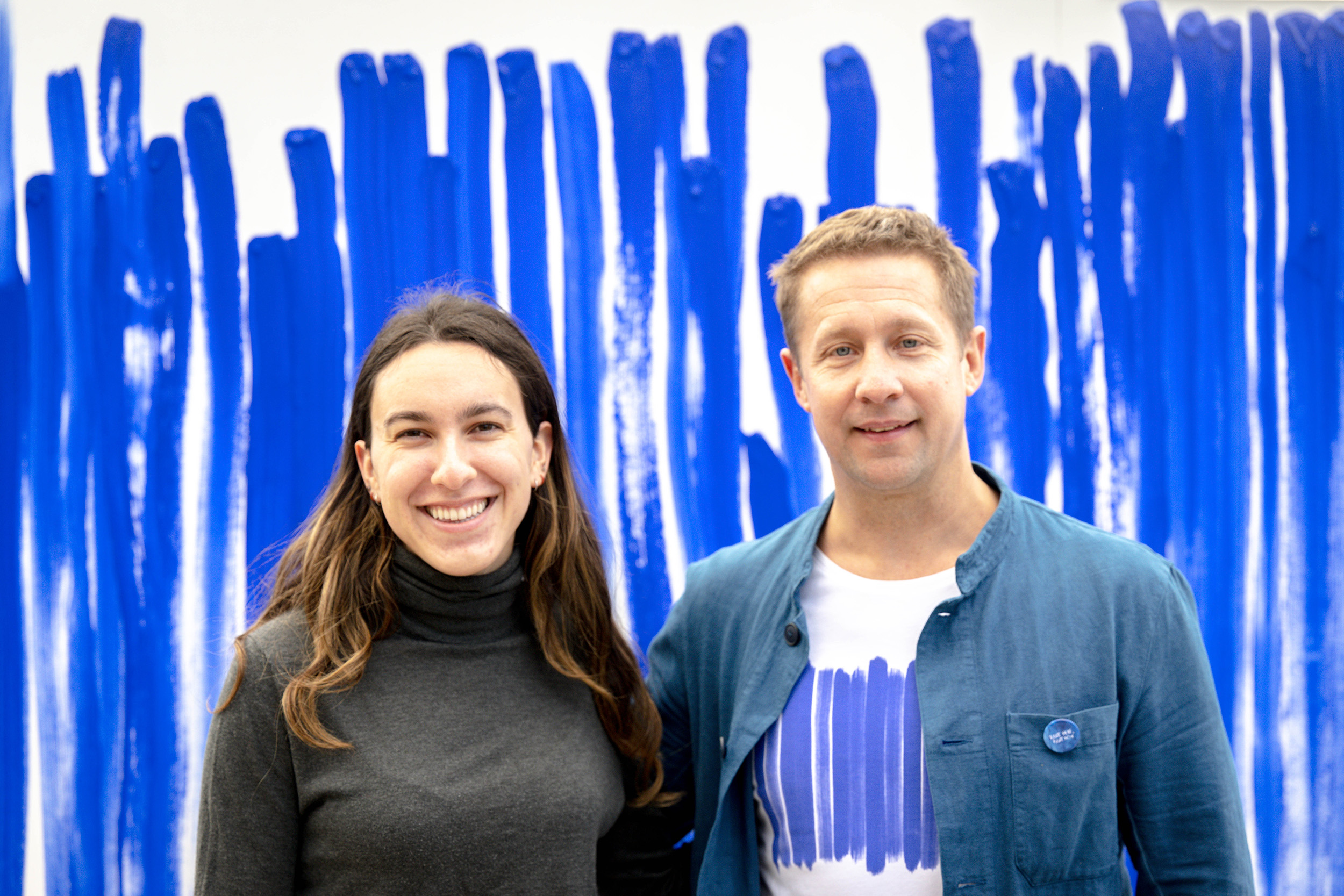 Jeppe Hein and Rachel Keady ’23 standing in front of  breath mural