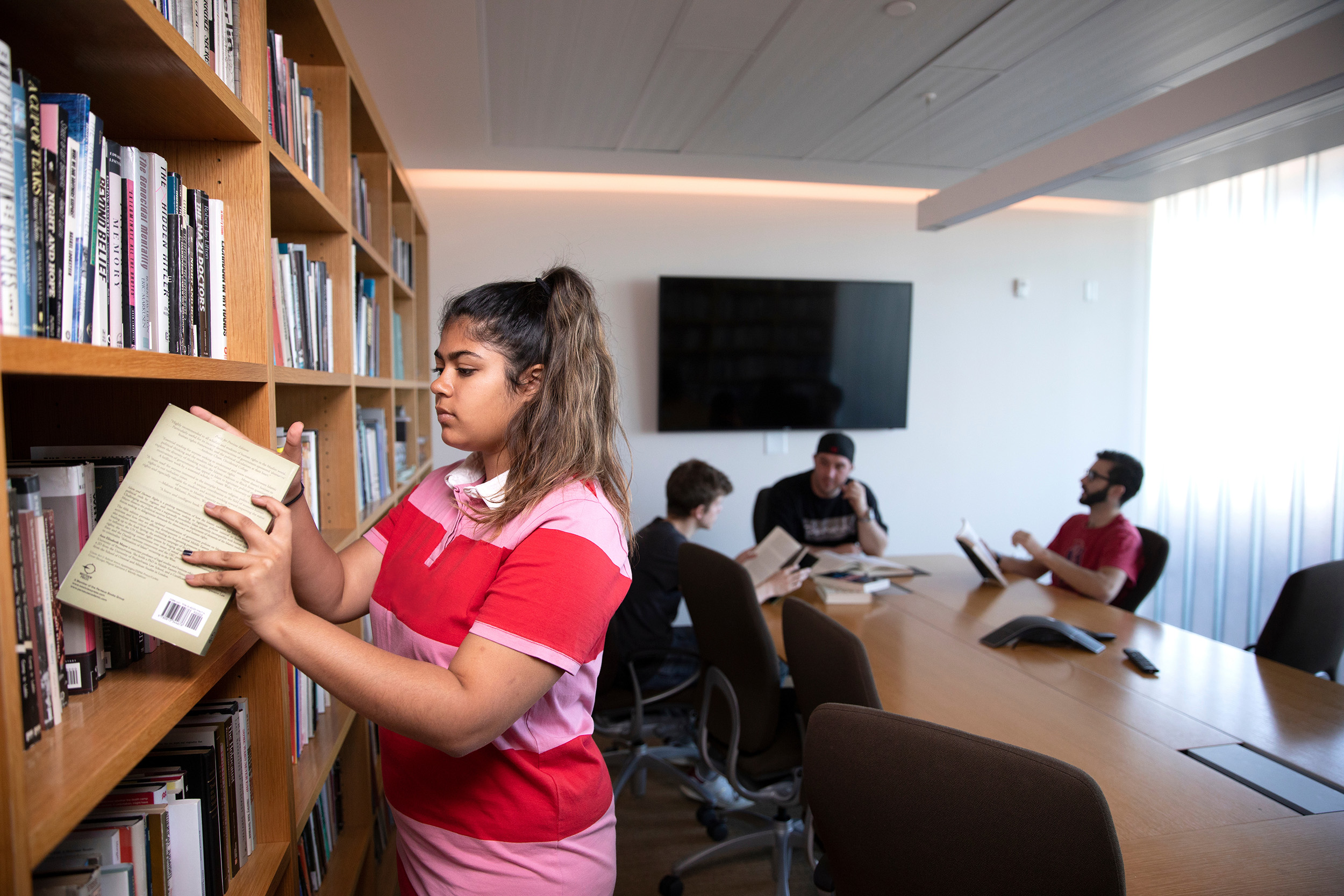 Students pursue research in the Center’s John K. and Lyn Roth library.