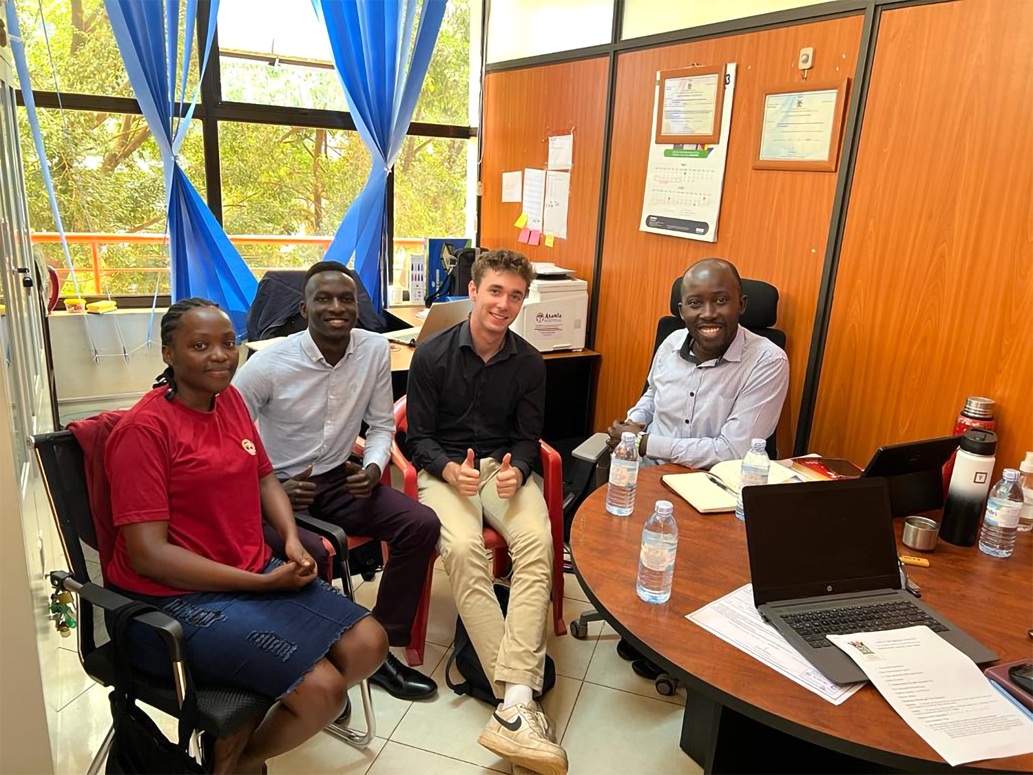 Lukas Huntington ’25 and Musizi University's program manager Jude Watimongo engage in an internship partner meeting with Asante Africa Foundation Uganda.