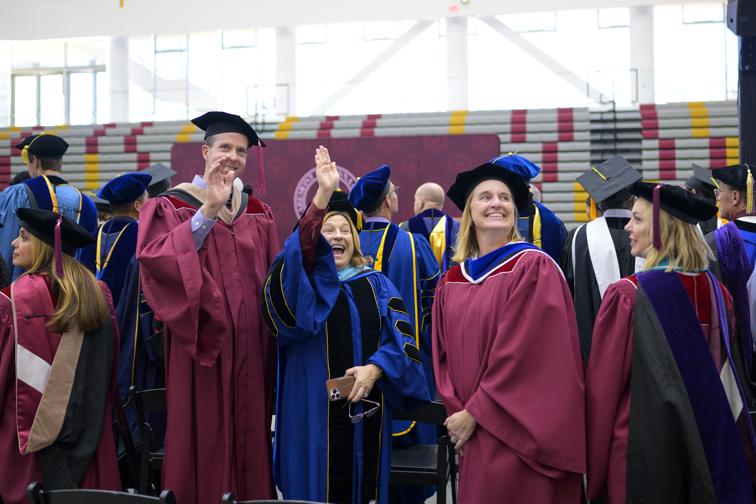 Sharon Basso and Diana "DT" Graves waving during Convocation 2023.