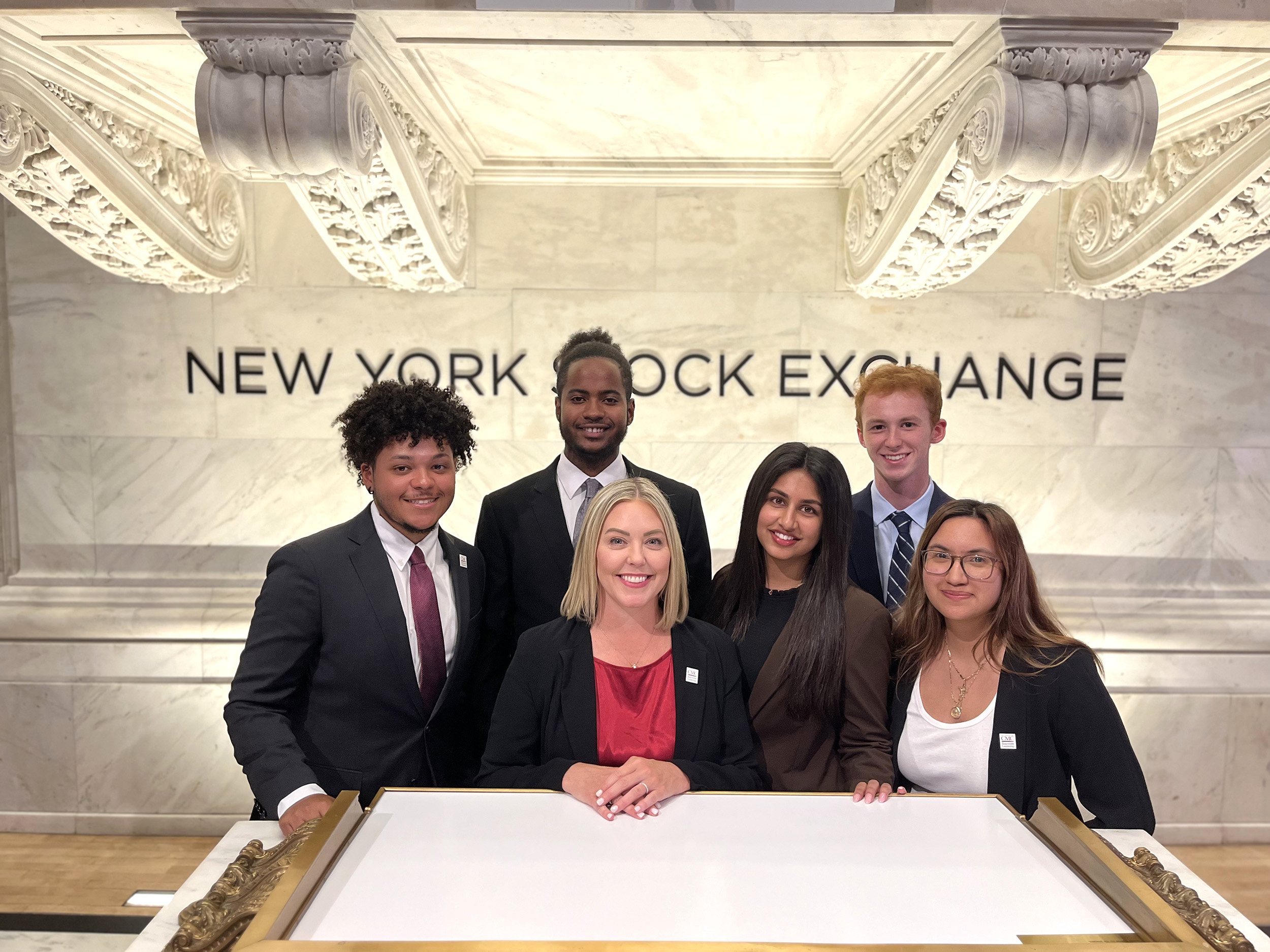 Zara Vakarth '24 with fellow students at the New York Stock Exchange.