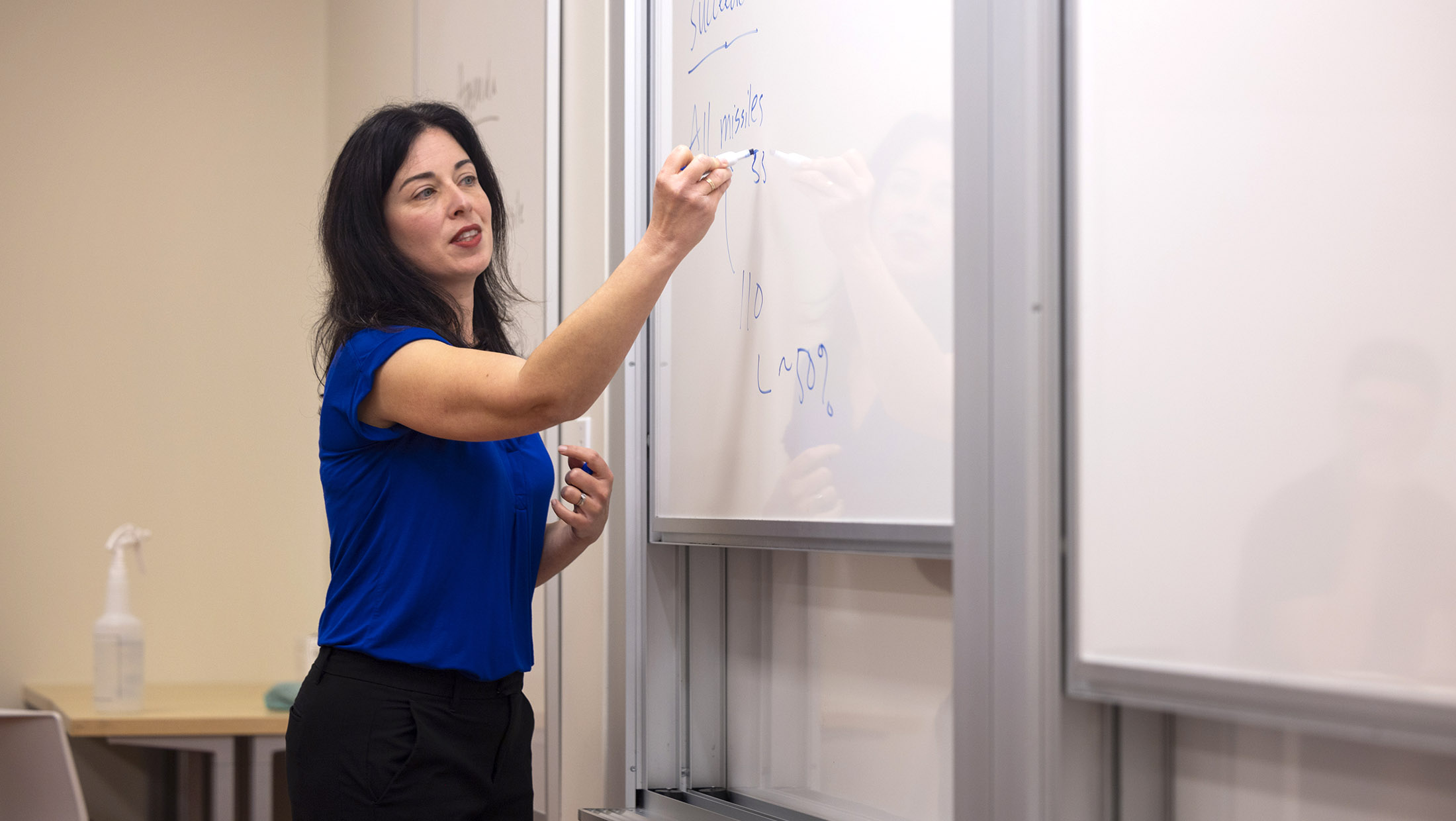 Professor Lisa Koch in front of her class.