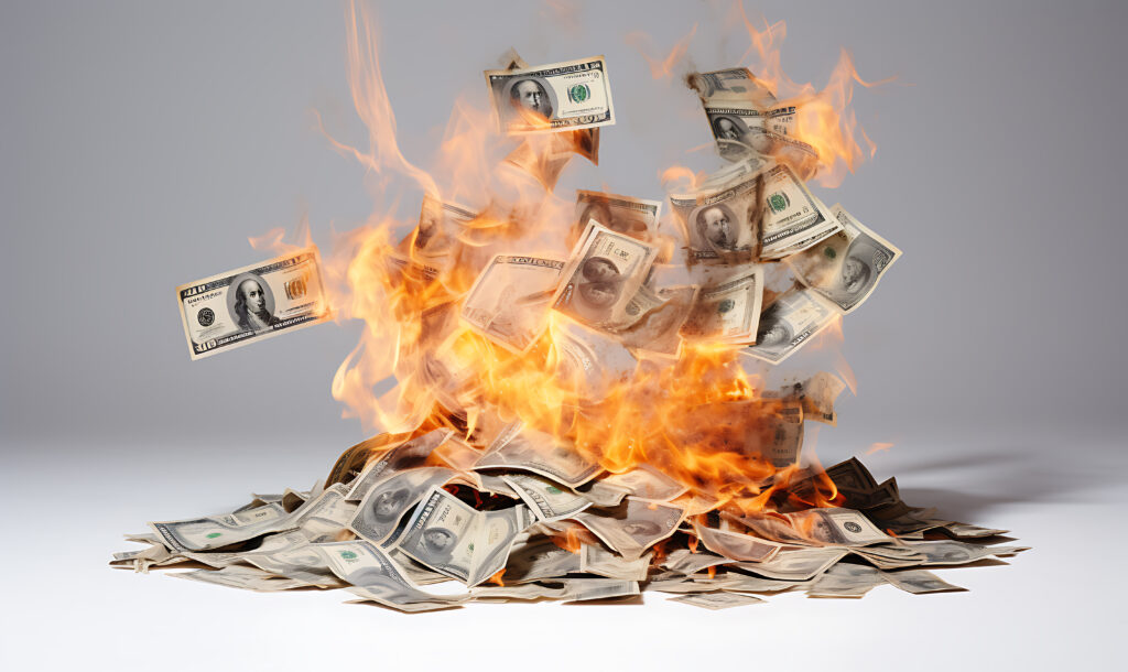 Money burning in a pile.