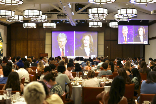 Students watch and discuss the September Presidential debate at the Ath