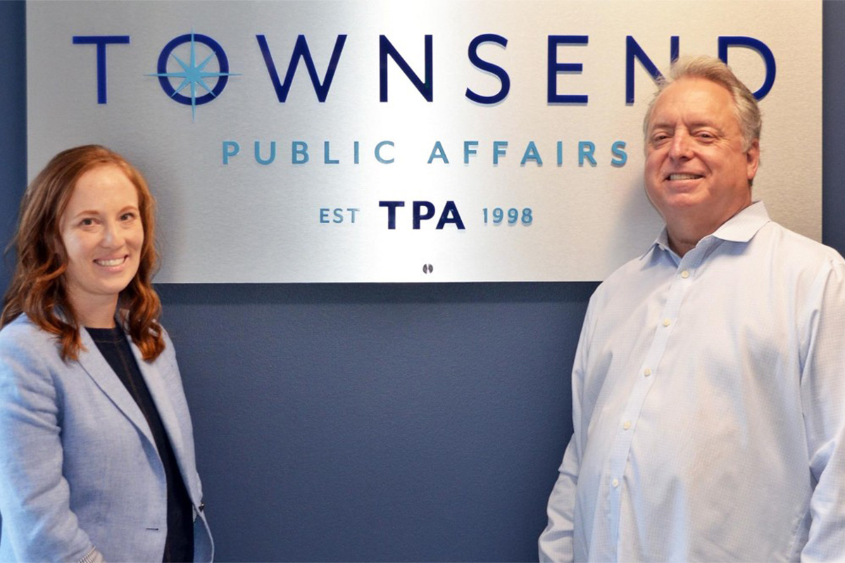 Colleagues Cori Takkinen ’11 (left) and Christopher Townsend ’82.