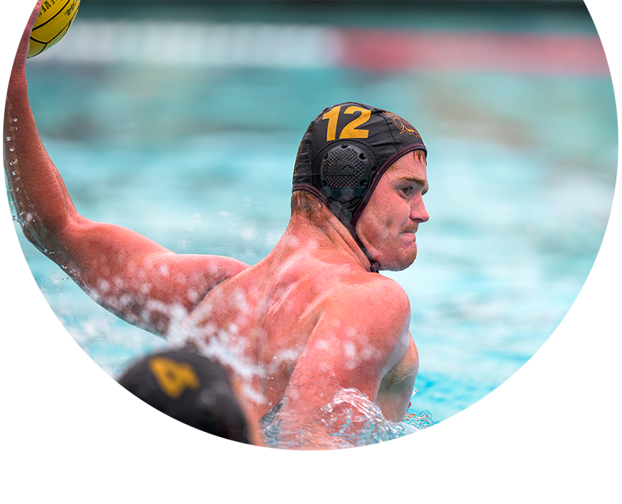 Nick Kennedy ’27, in mid-throw while playing water polo.