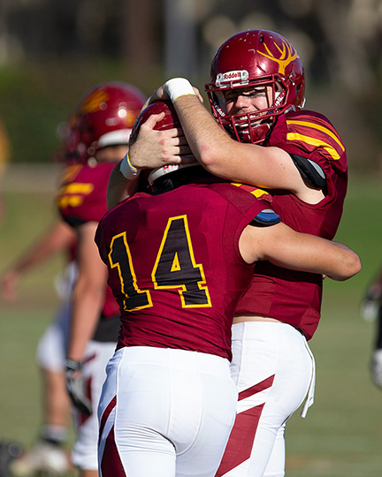 CMS Football players celebrate success.