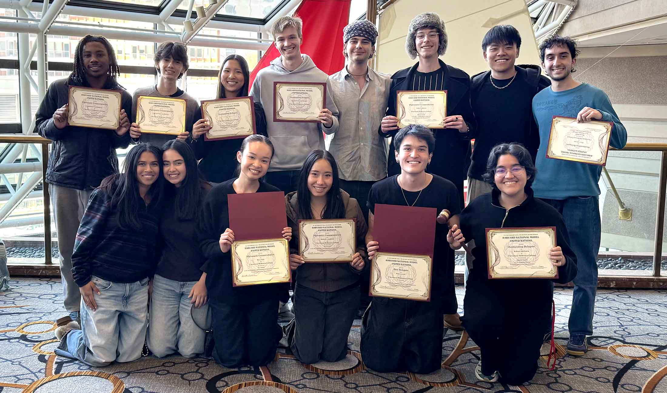 MUN students posing with their awards