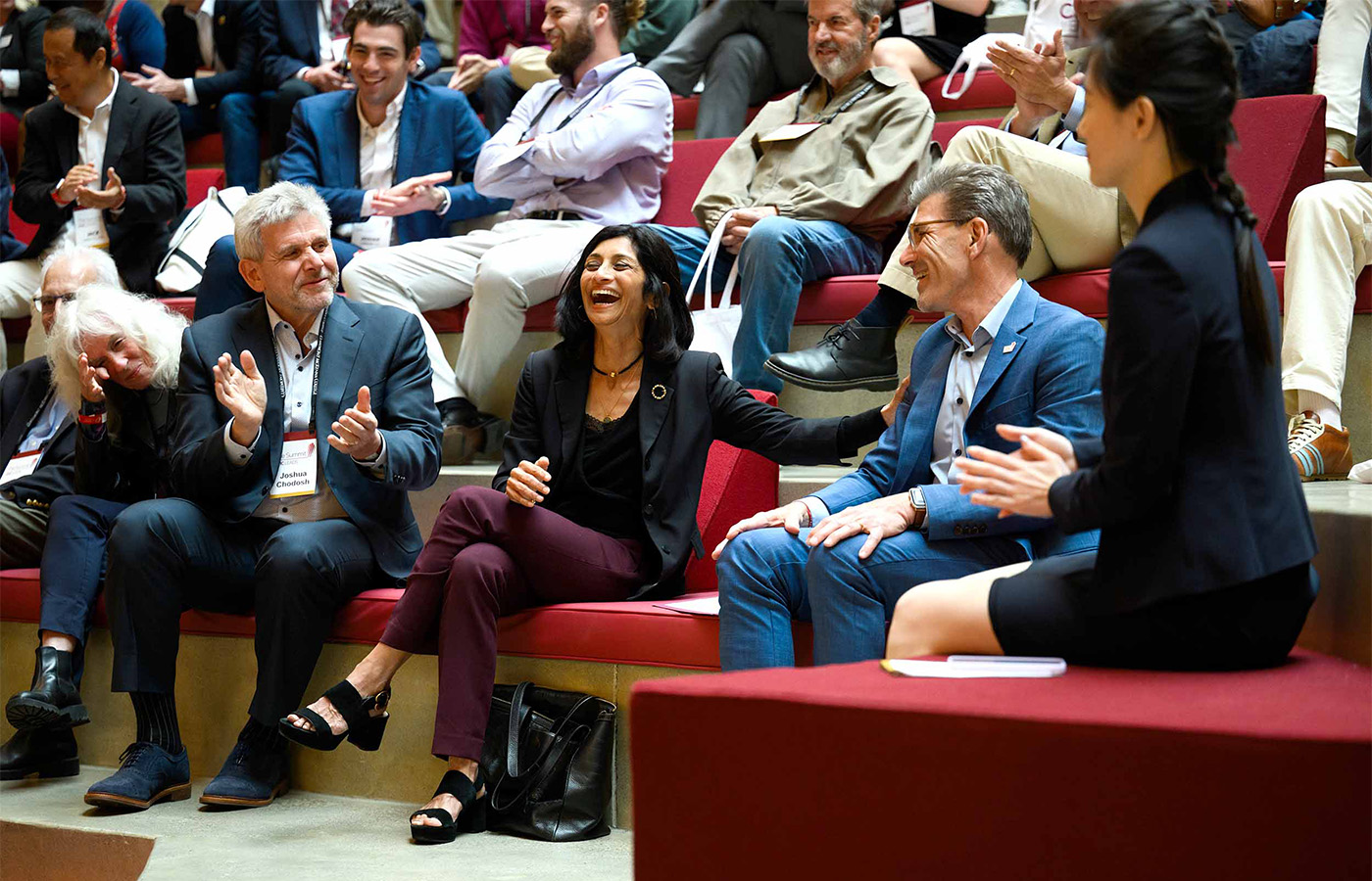 Hiram and Priya, surrounded by The Summit attendees on the social stairs.