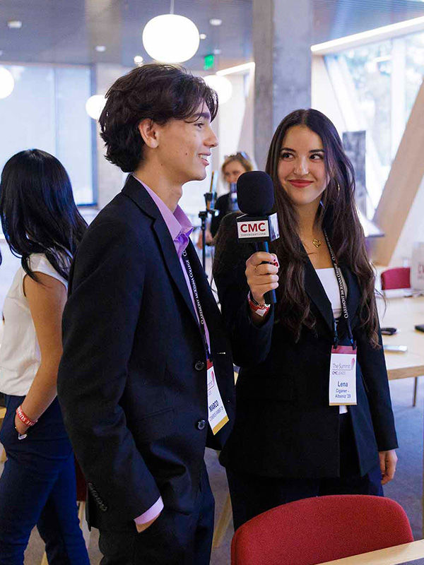 A student podcaster interview an attendee.