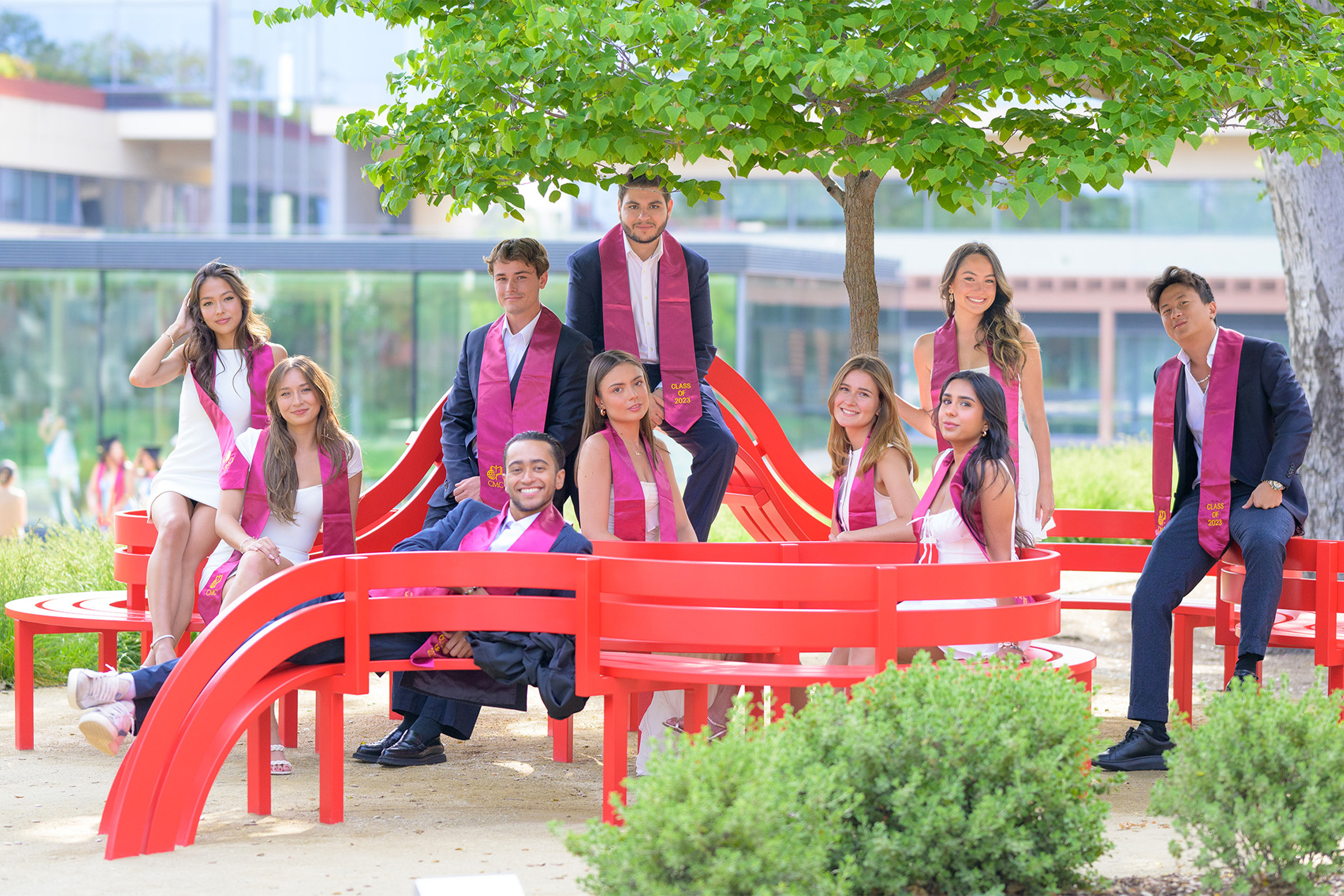 Members of CMC's Class of 2026 graduates gathered at Jeppe Hein's Modified Social Benches