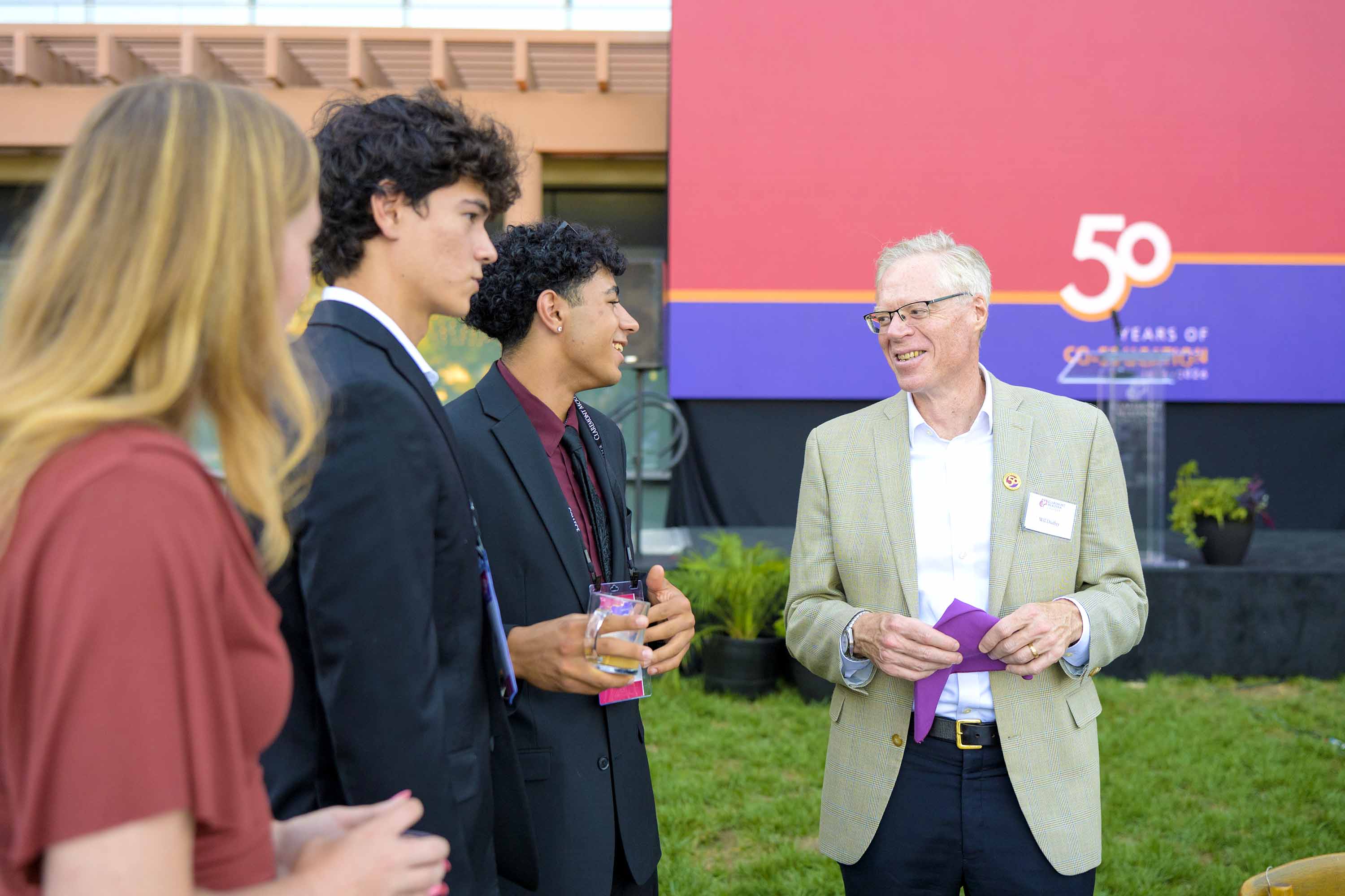 President Dudley (right) with students attending ImpactCMC 2026.