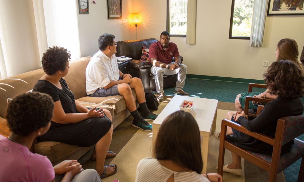 Vince Greer talking with students at the CARE Center