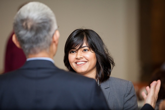 Student engaging with a professional at a networking event.