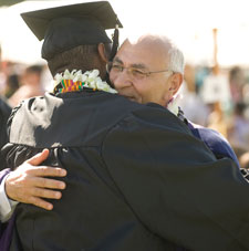 recent graduate embracing relative