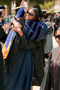 recent graduate embracing relative