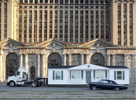 Mike Kelley's Mobile Homestead in front of the abandoned Detroit Central Train Station.
