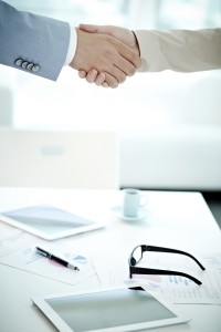 Handshake over table