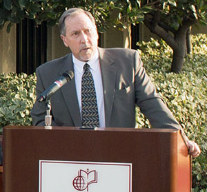 CMS Director of Athletics Mike Sutton at podium