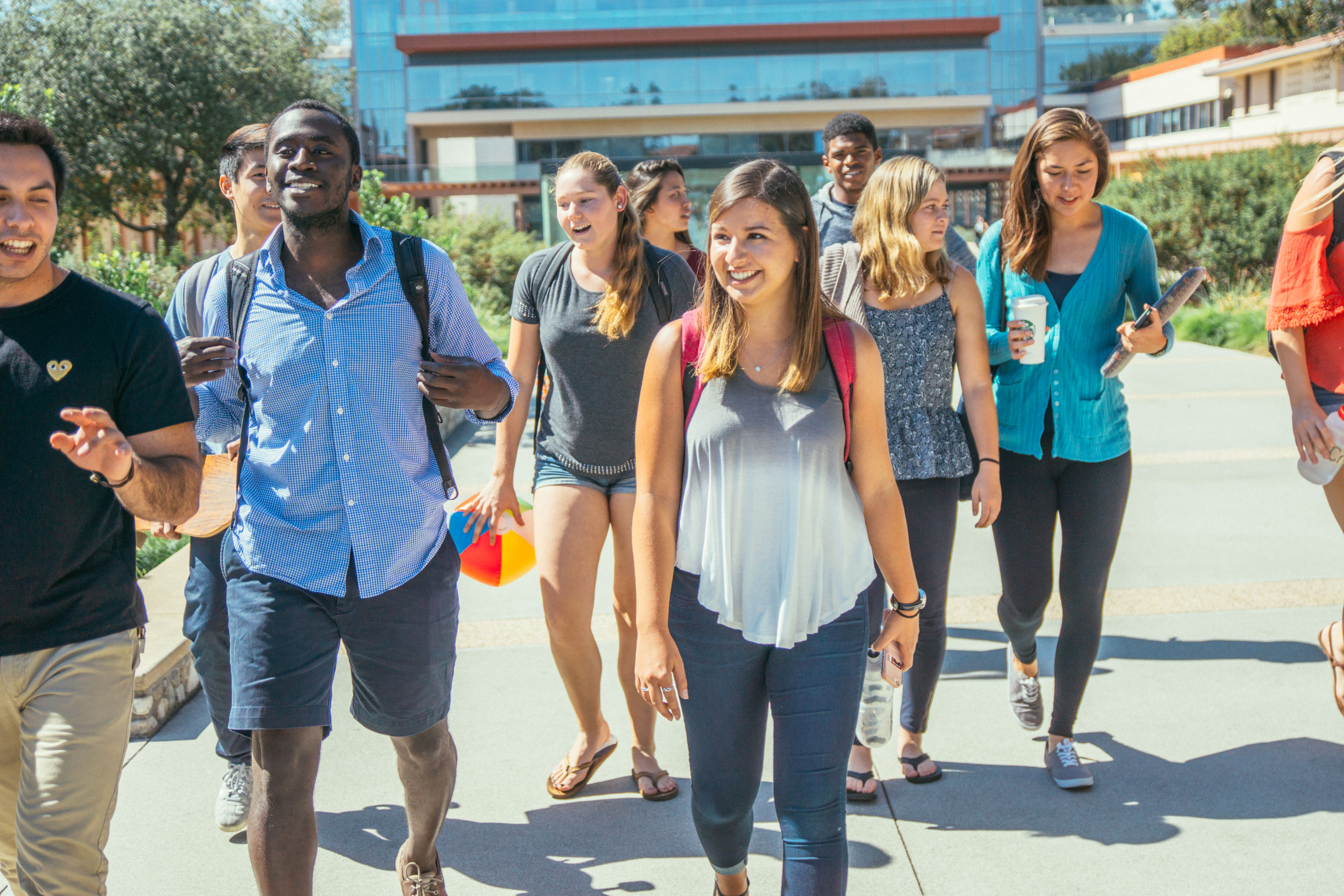 A group of CMC students walk from the Kravis Center.