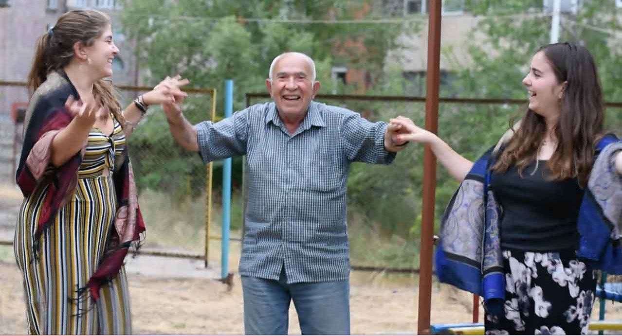 Anoush Baghdassarian and Ani Schug with a Syrian refugee