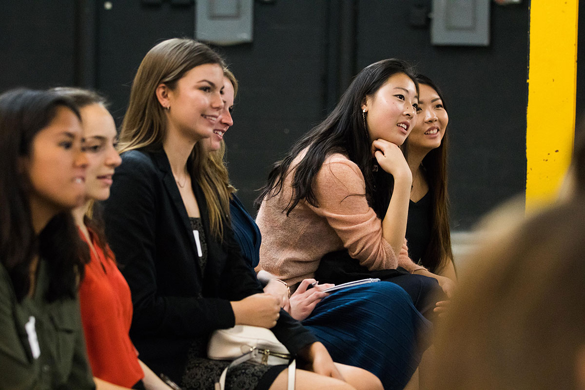 students listen to presentation