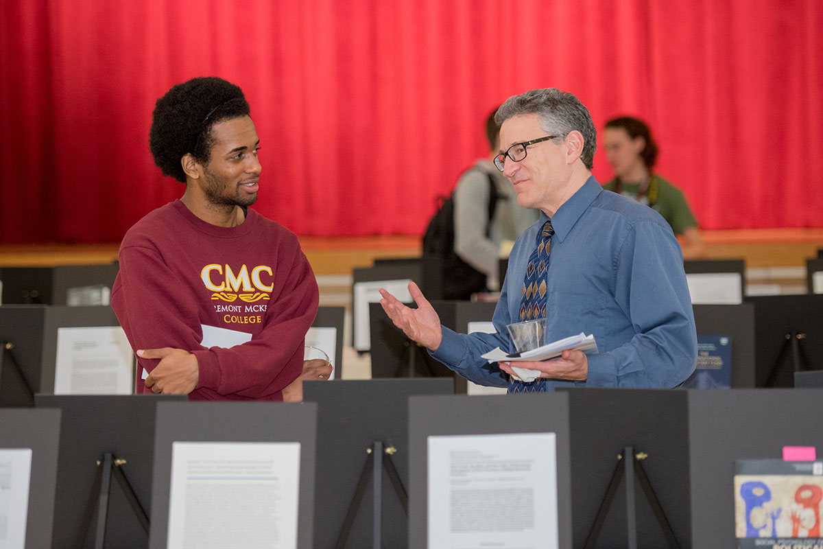 Student and professor discuss research