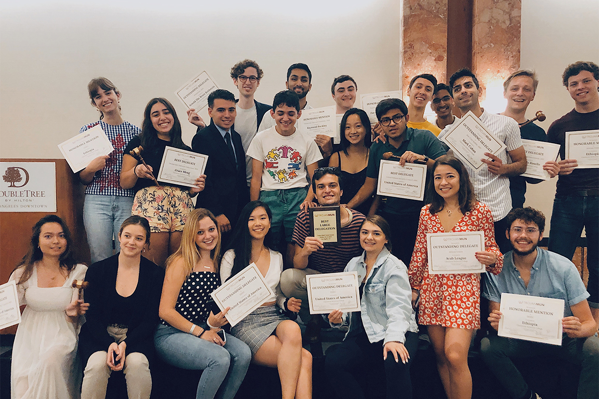 CMC Model UN team members holding their awards
