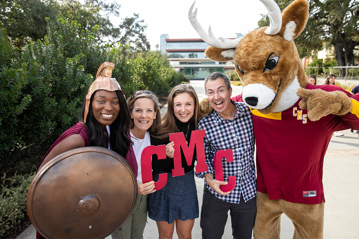 Parents with their CMC student and CMS mascots