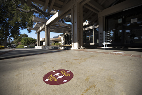 Sign promoting social distancing on campus