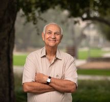 Prof. Massoud between campus trees