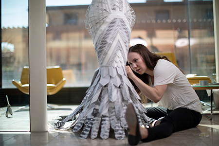 Tori Johnson works on her papier-mache dress