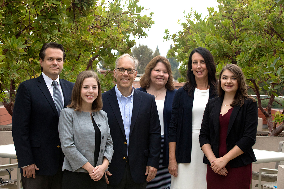 Professors Zach Courser '99 and Eric Hellan stand with their Policy Lab research team
