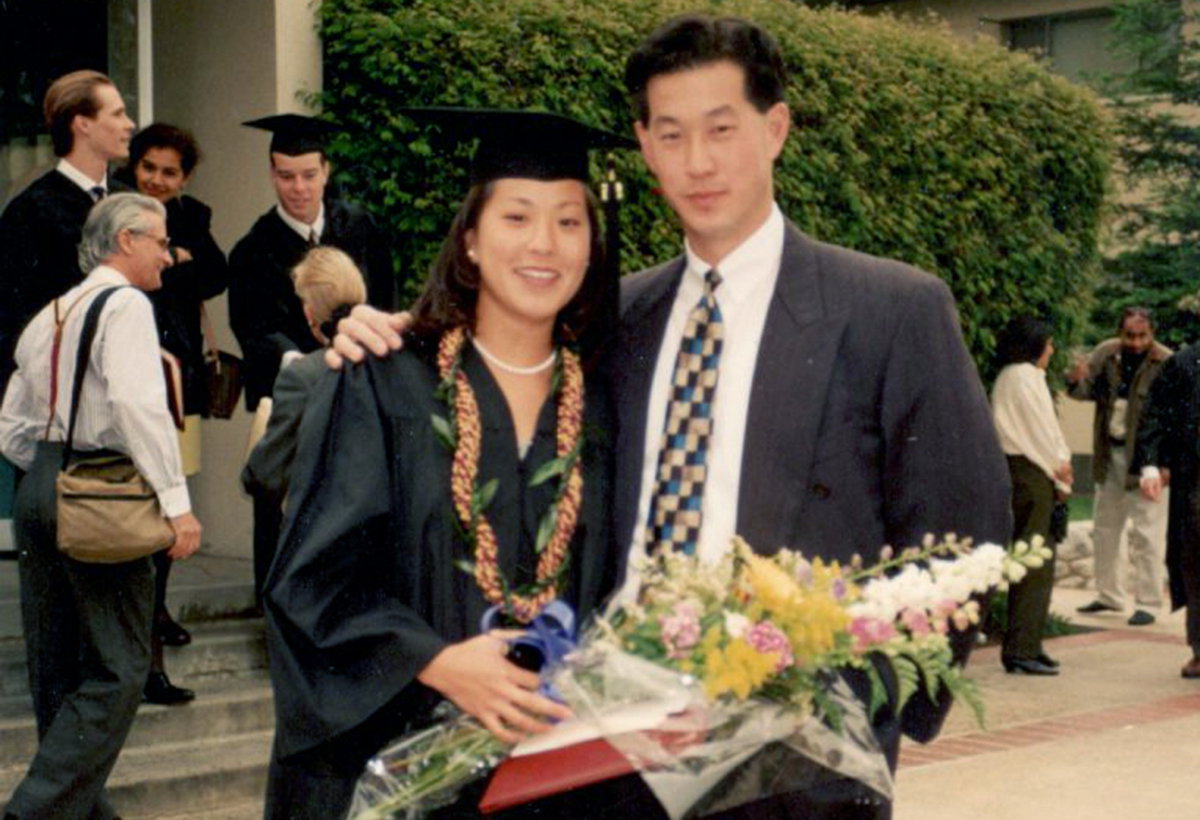Emily Cotter ‘95 in her cap and gown with brother Erik Chan ’92 at her CMC commencement