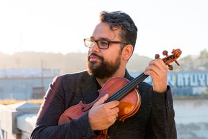 Portrait of Vijay Gupta with his violin
