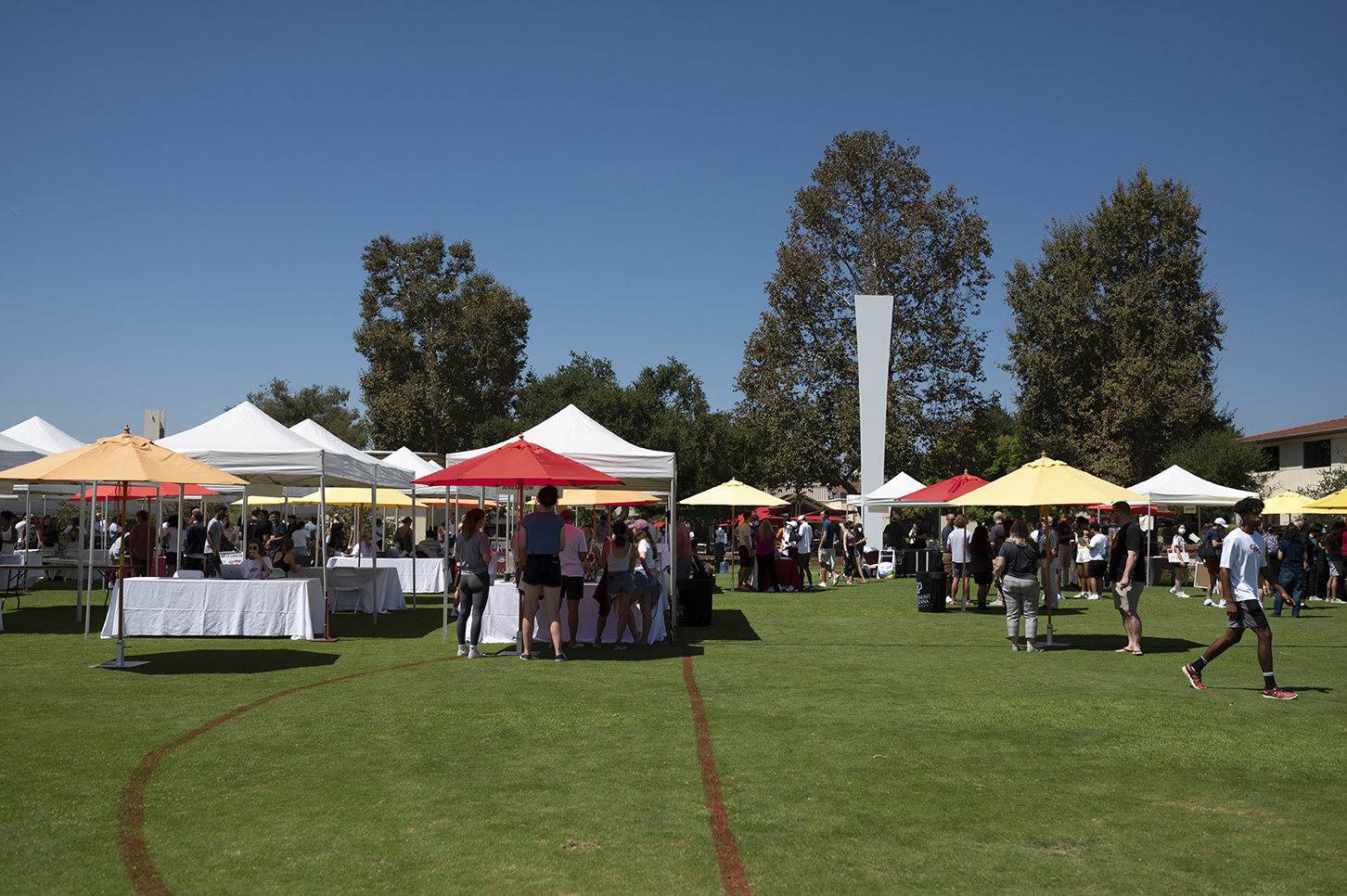 Information booths line Parents Field for CMC’s Club and Institute Fair.