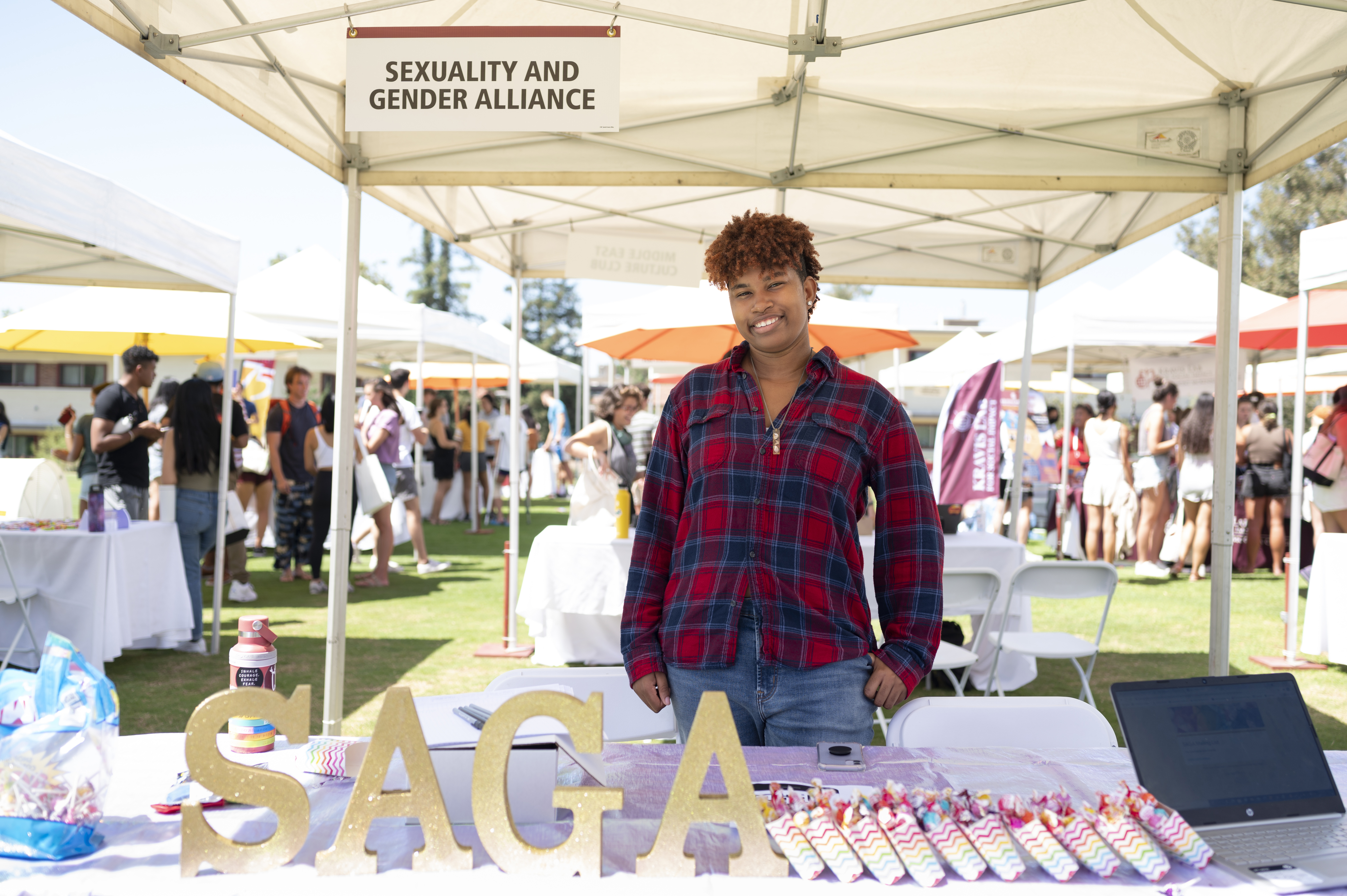 Jenasis Yarrell ’24 shares information at the Sexuality and Gender Alliance booth.