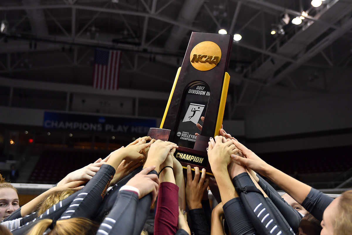 Athenas raise NCAA championship trophy