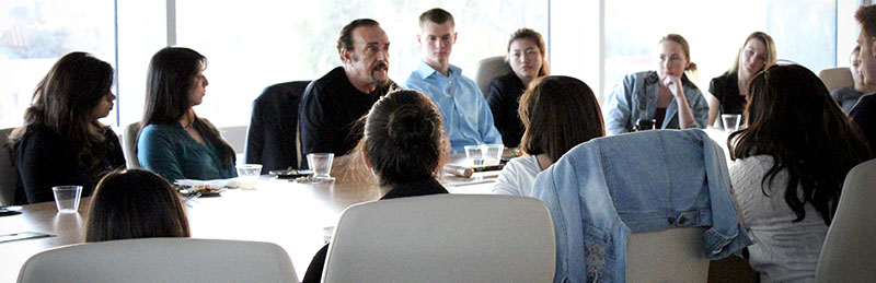 students sitting around table