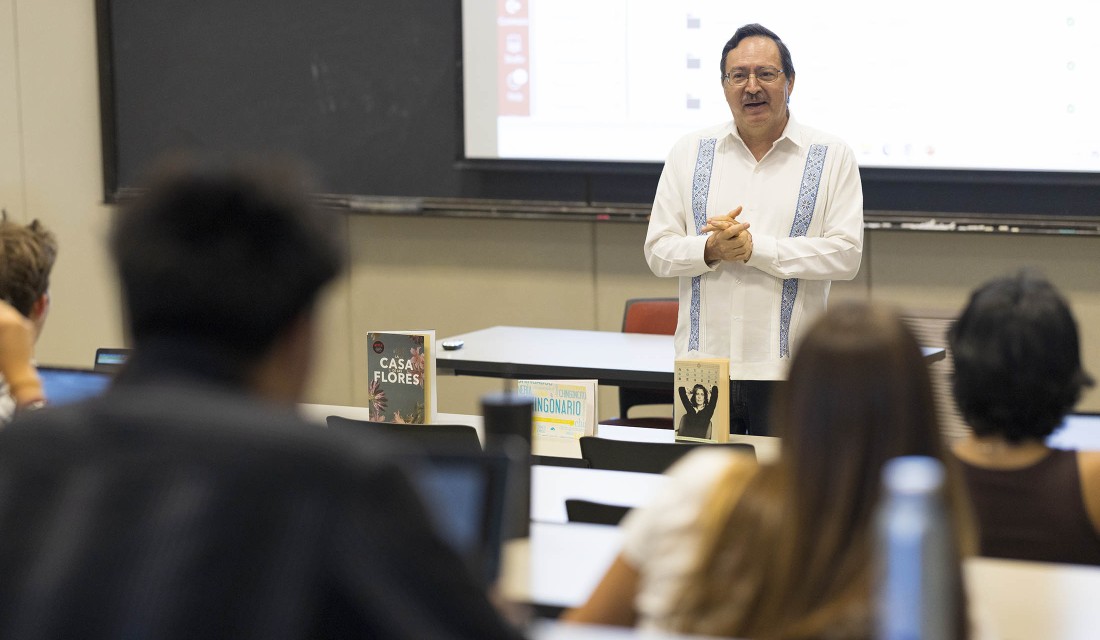 Prof. Salvador Velazco speaking in front of class